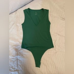Target Xs body suit , green, worn a few times and is so cute !